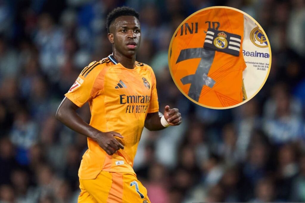 Vinicius en San Sebastián en un partido de Liga y al lado su brazalete preparado en el vestuario